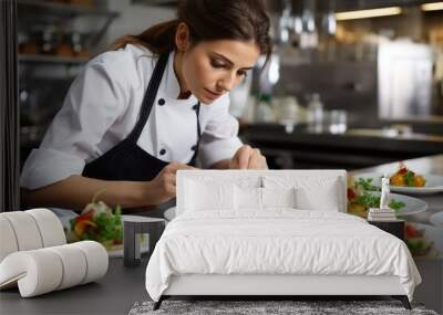 Female chef in a professional kitchen making an elaborated dish Wall mural