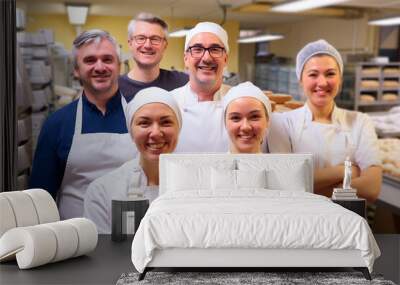 Happy bakery team with apprentices in training. Wall mural