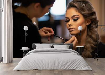 Makeup artist applying makeup and eyeshadow to a model Wall mural