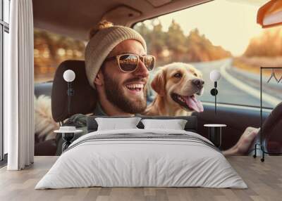 man and dog enjoying a car ride Wall mural