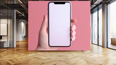 Woman using smart phone on pink background. Closeup of female hands with natural manicure with a mobile phone. Online shopping, business, education, communication concept. Isolated white screen Wall mural