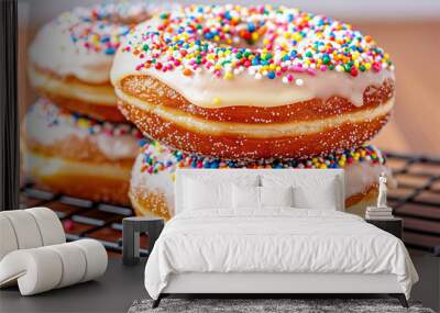 Delicious donuts topped with colorful sprinkles on a cooling rack. Vibrant dessert with creamy frosting perfect for sweet treats and indulgence Wall mural