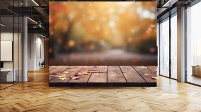 Empty wooden table over blurred autumn park background, product display montage Wall mural