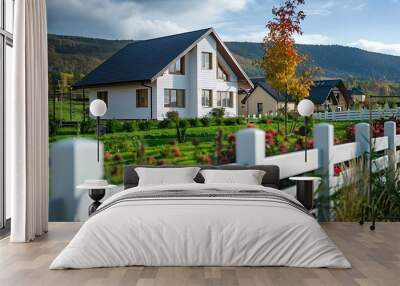 White wooden fence in front of a house on a sunny day. Wall mural