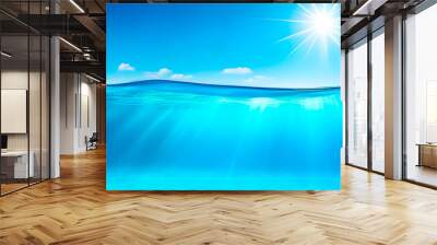 Beautiful Split underwater view of light blue ocean and sunny sky. Banner format. Wall mural