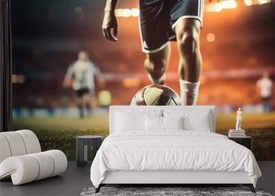 Soccer player in action kicking the ball on the field at night Wall mural