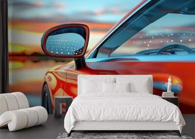 Close up of a red car with a sunset reflected in the side view mirror. Wall mural