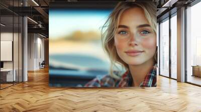 Young woman in a plaid shirt, confidently driving a truck, natural lighting Wall mural