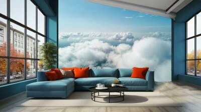 Beautiful aerial view of nature with white clouds and blue sky captured from a drone on a sunny day from high altitude in the front perspective Wall mural