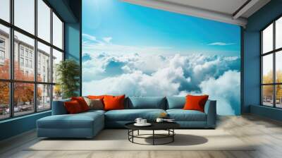 Beautiful aerial view of nature with white clouds and blue sky captured from a drone on a sunny day from high altitude in the front perspective Wall mural