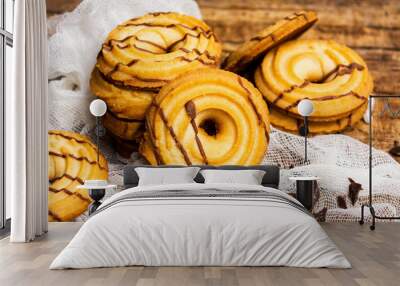 Baked biscuits with cacao topping on rustic table Wall mural