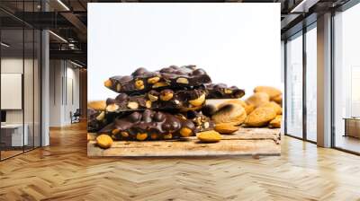 Chocolate with almonds on a table Wall mural