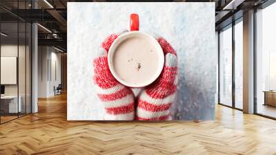 female hands in gloves holding hot chocolate Wall mural