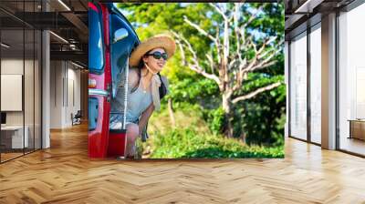 Happy female tourist in a tuk tuk Wall mural