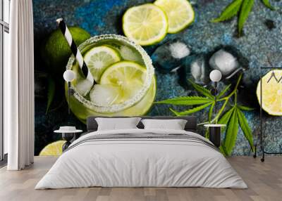 Lime cocktails with marijuana on stone table Wall mural