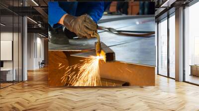 Man cutting metal with a welding cutting torch Wall mural