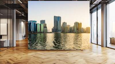 Panoramic view of Sharjah waterfront in UAE at sunset Wall mural