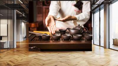 Woman offering traditionally prepared Chinese tea Wall mural