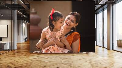 portrait of loving Indian mother and daughter at village Wall mural