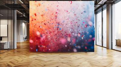 A colorful explosion of confetti is scattered across the sky. The bright colors and the way the confetti is falling create a sense of joy and celebration Wall mural