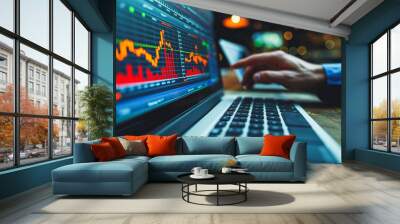 A person is using a laptop to look at stock market charts Wall mural