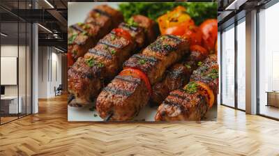 A plate of meat skewers with vegetables and parsley. The skewers are grilled and look delicious Wall mural