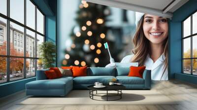 A mid shot of a dental hygienist wearing a Santa hat and holding a toothbrush, combining festive cheer with professional dental care, ideal for holiday themed dental promotions Wall mural