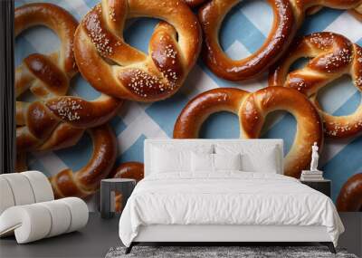 German pretzels with salt, traditional homemade pretzels, Bavarian style bretzels on blue flat lay background Wall mural