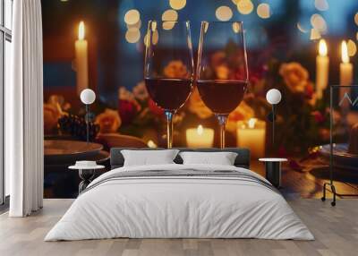 A romantic candlelit dinner table with two glasses of red wine, roses, and soft lighting, ideal for celebrations like Valentine's Day or special dinners. Wall mural