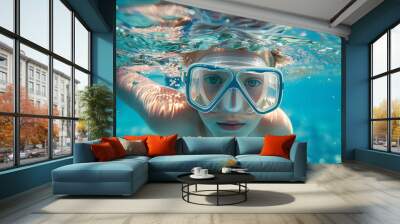 Child snorkeling underwater with diving mask, sea exploration portrait. Wall mural