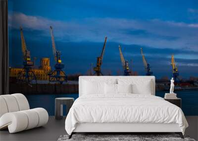 Cranes in the harbor at night Wall mural