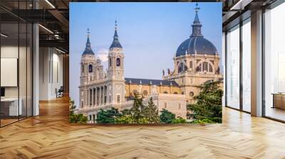 Sunset image of the Almudena Cathedral in Madrid with the full moon in the background Wall mural