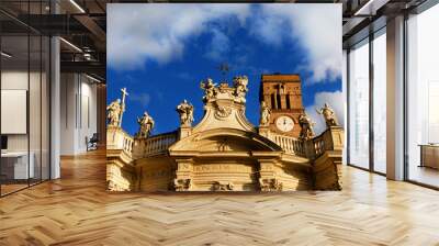 Holy Cross in Jerusalem church, wonderful late baroque masterpiece with marble statues of saints, turns to gold at sunset, in Rome (18th century) Wall mural