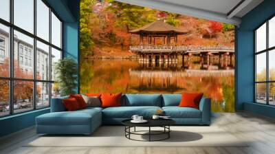 Scenic view of Nara public park in autumn, with maple leaves, pond and old oriental pavilion reflected in the water Wall mural