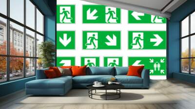 Full set of 22 isolated Emergency exit symbols on green rectangle board. Official ISO 7010 safety signs standard Wall mural