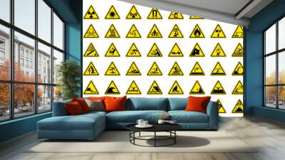 Full set of 78 isolated hazardous symbols on yellow round triangle board warning sign. Official ISO 7010 safety signs standard. Wall mural