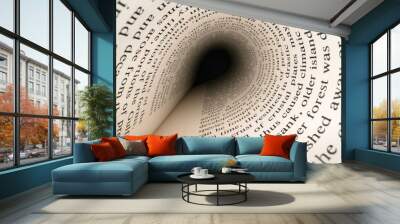 Inside the book concept. Latin letters and words on an tunnel shaped, perspective book page with black dramatic light. Education, knowledge concept Wall mural