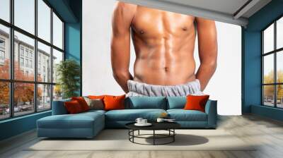 Strong Athletic handsome teenager afro Fitness Model Torso showing six pack abs. showing his muscles Wall mural