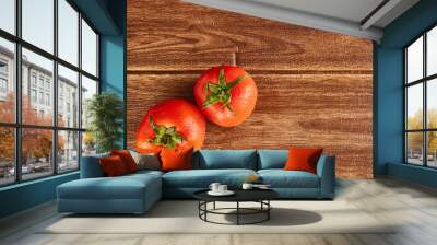 Top  of two tomatoes with water drops on them on the wooden table Wall mural