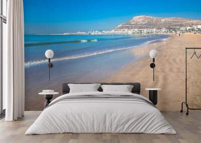 Agadir beach on the Atlantic African coast in the summertime with yellow sand and turquoise water in Morocco Wall mural