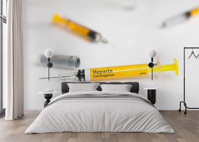 Pre filled heparin syringe on white table Wall mural