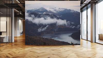 clouds over the forest and lake at sunrise. Aerial top view cloudscape. Transylvania, Romania. Mountain scenery in the Transylvanian Alps in summer, with mist clouds.  Wall mural