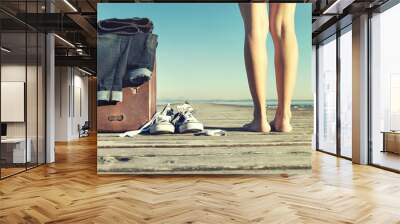 adventurous woman reaches her destination to the sea Wall mural