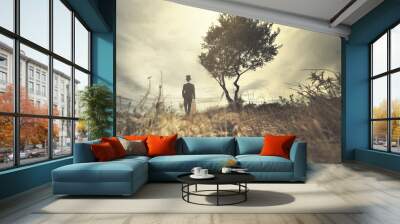 elegant man with a tuba and suitcase walking in a wild and surreal place Wall mural