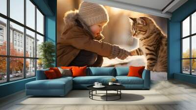 Little boy petting a cat in the snow on a sunny winter day. Animal love. Image generated with AI Wall mural