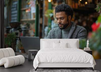 People city lifestyle young man sitting at cafe using laptop computer typing keyboard online outside banner panorama. Modern lifestyle, connection, business, online studying, freelance work concept Wall mural