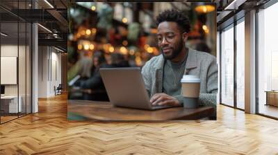 People city lifestyle young man sitting at cafe using laptop computer typing keyboard online outside banner panorama. Modern lifestyle, connection, business, online studying, freelance work concept Wall mural