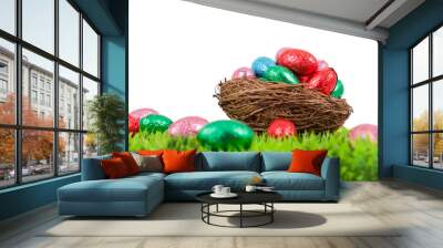 Easter eggs in nest on green grass, isolated on white isolated b Wall mural