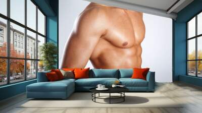 Healthy muscular young man on grey background Wall mural