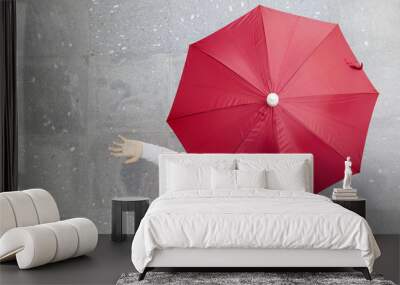 Man holding a red umbrella outdoors Wall mural